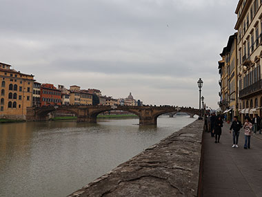 Sidewalk with bridge in distance