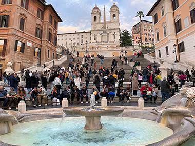 Closeup of fountain with Spanish Steps in background