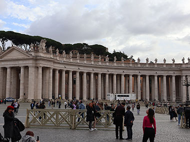 People posing for pictures at St. Peter's Basilica