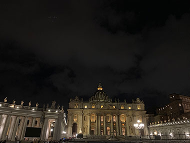 - St. Peter's Basilica in distance at night