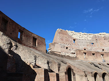 Blue sky beyond the Colosseum