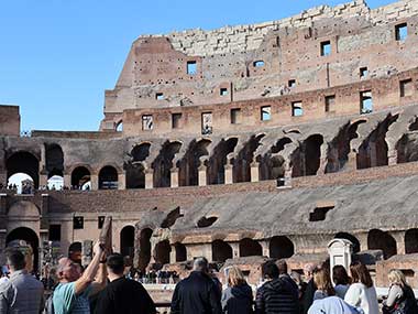 People taking pictures inside the Colosseum