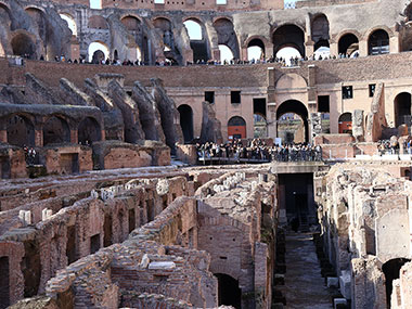 People viewing the floor of the Colosseum from above