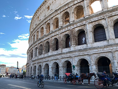 Horse drawn carriage in front of the Colosseum