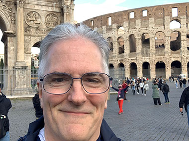 Pat in front of Constantine's Arch and the Colosseum