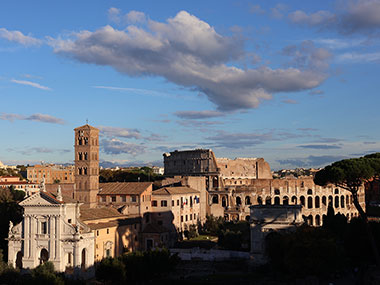 Colosseum beyond Roman Forum and Colosseum as the sun is setting