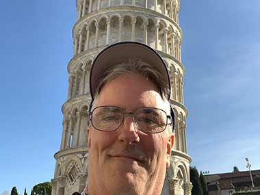 Pat directly in front of the Leaning Tower of Pisa