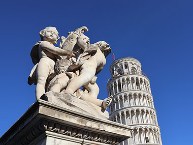 Statue next to the Leaning Tower of  Pisa