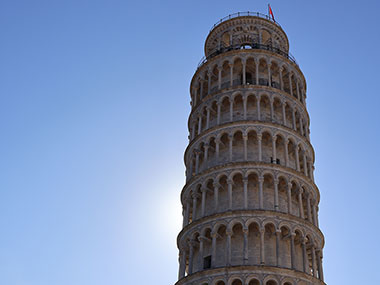 Sun behind Leaning Tower of Pisa