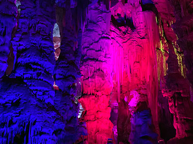 Colored lights shine on wall of cave  Gibraltar