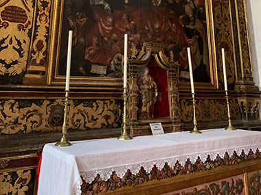 Four candles on an altar
