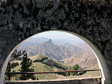 Mountains framed by window type frame