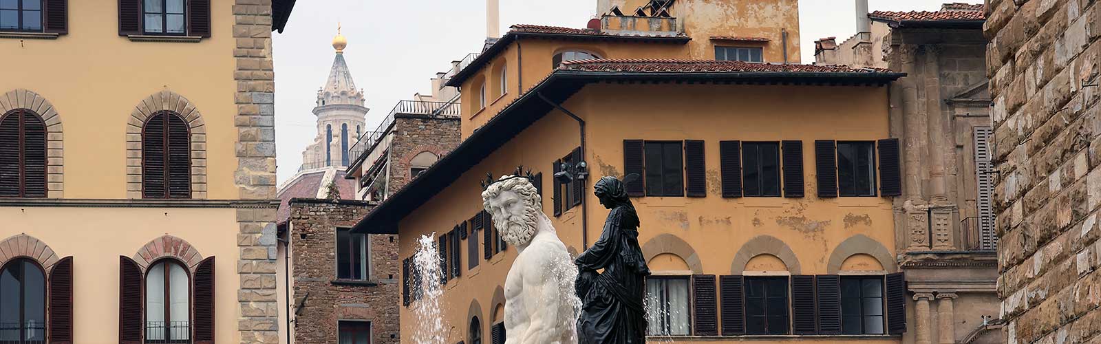 Statues in front of buildings