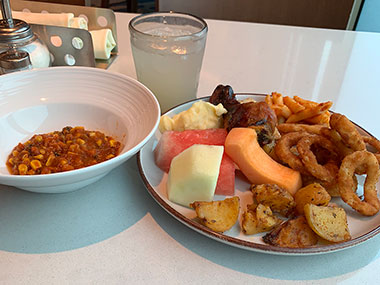 Bowl and plate of food from buffet on Enchanted Princess