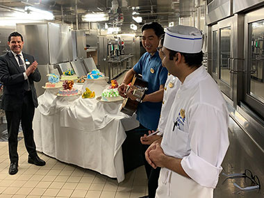 Kitchen staff greeting passengers and singing - Enchanted Princess