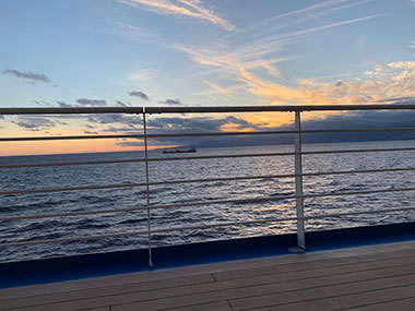 Railing of ship in front of sunset - November 29, 2023 Sunset
