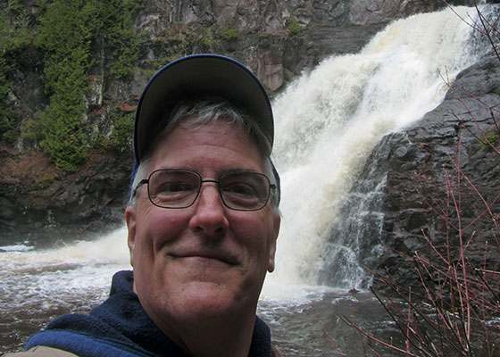 Pat in front of the waterfall