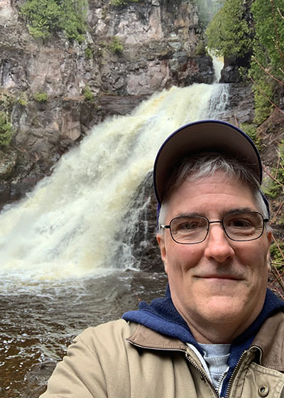 Pat selfie in front of the waterfall