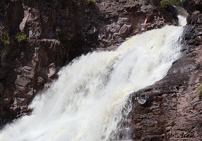 Closeup of white foam of waterfall