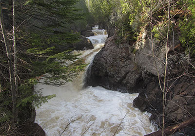 Cascade River rushes under bridge