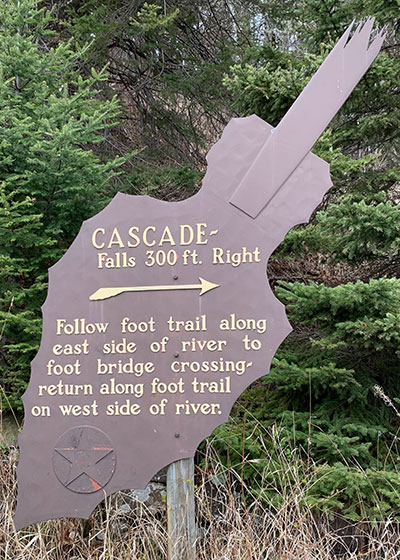 Sign: Cascade Falls 300 feet to right