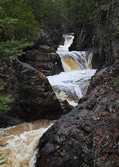 Three small waterfalls in river