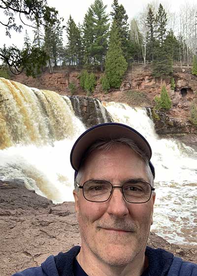 Pat next to waterfall