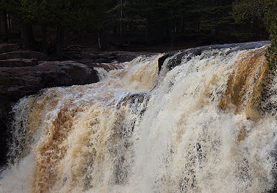 Closeup of rapids going over waterfall