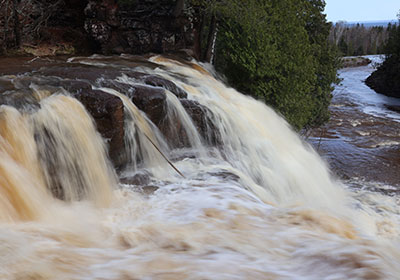 Water passses over upper waterfall