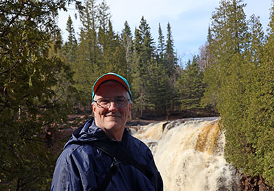 Pat in front of waterfall