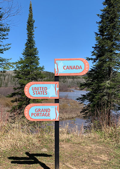 Directional Sign for Canada, United States and Grand Portage