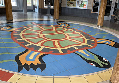 Turtle mural on floor of visitor center