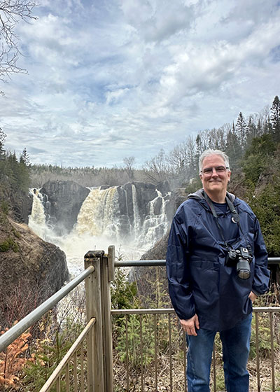 Pat in front of waterfall