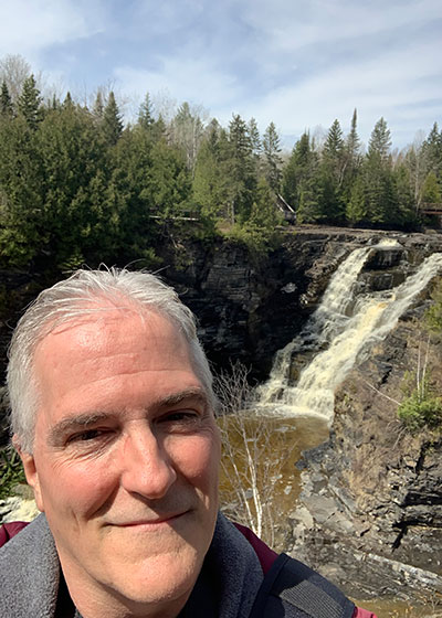 Pat in front of waterfall