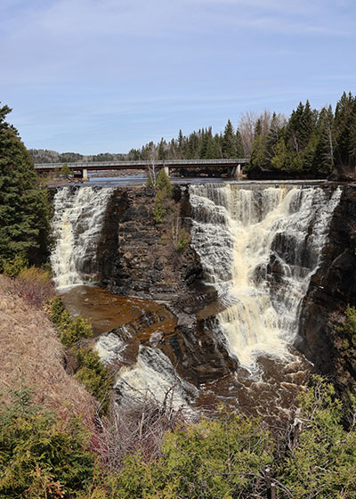 Waterfall and bridge in distance