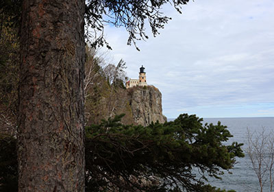 Lighthouse beyond tree