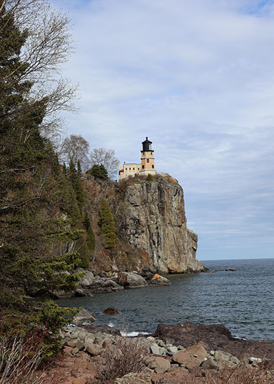 View of Split Rock Lighthouse from rocky beach