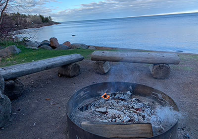 Lake Superior behind camp fire in 2022
