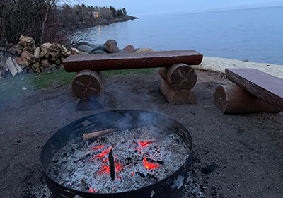Fire pit in front of Lake Superior