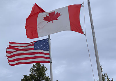 American and Canadian flags