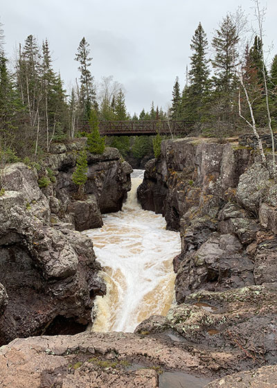 Bridge crosses river in distance