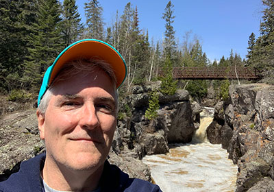 Pat in front of bridge over Temperance River