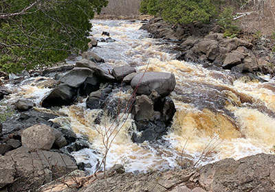 River flows by rocks