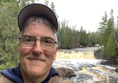 Pat selfie in front of river