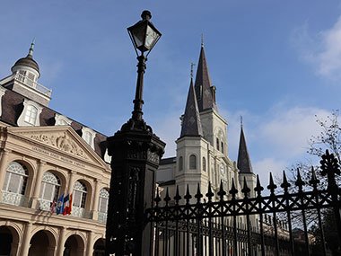 Street lamp on Jackson Square with cathedral in the distance