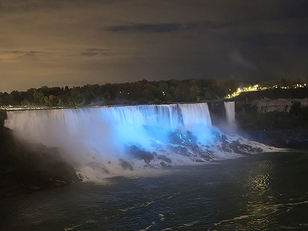 White light shines on Niagara Falls as viewed from Canadian side