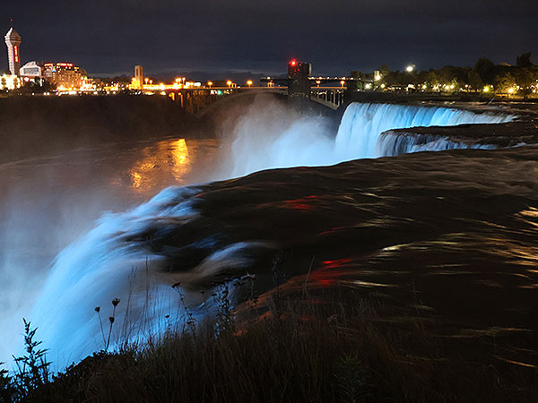 Water flowing over Niagara Falls on American side at night