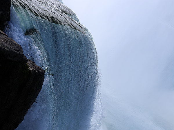 Extreme close up of water flowing over Niagara Falls on American side