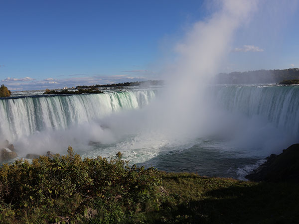 Mist rises above Niagara Falls as viewed from Canadian side