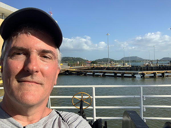 Pat in front of closed lock in Panama Canal